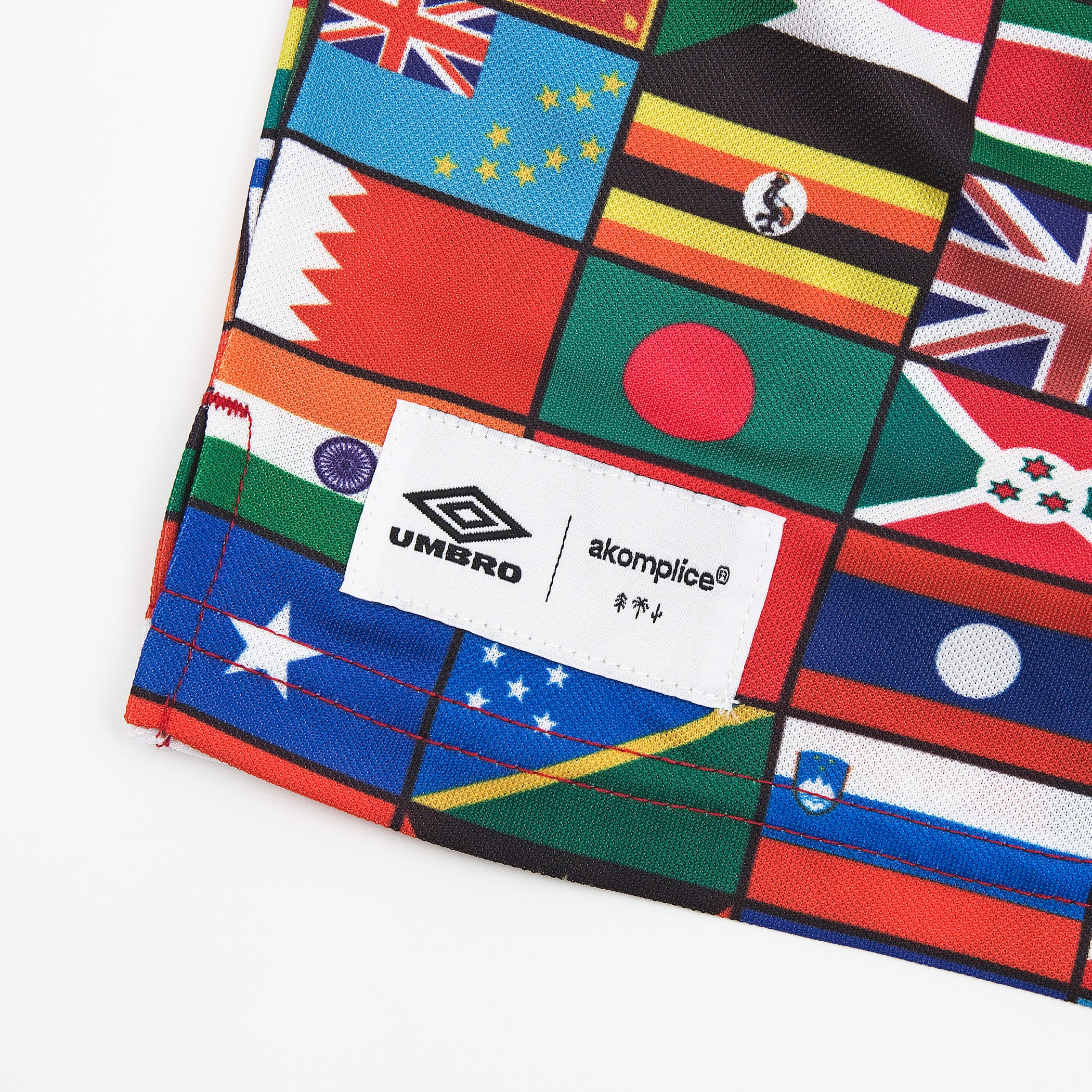 UMBRO x AKOMPLICE PEACE NYLON SHORT